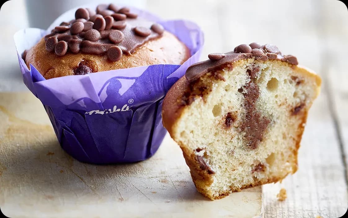Chocolate chip muffins, one cut in half