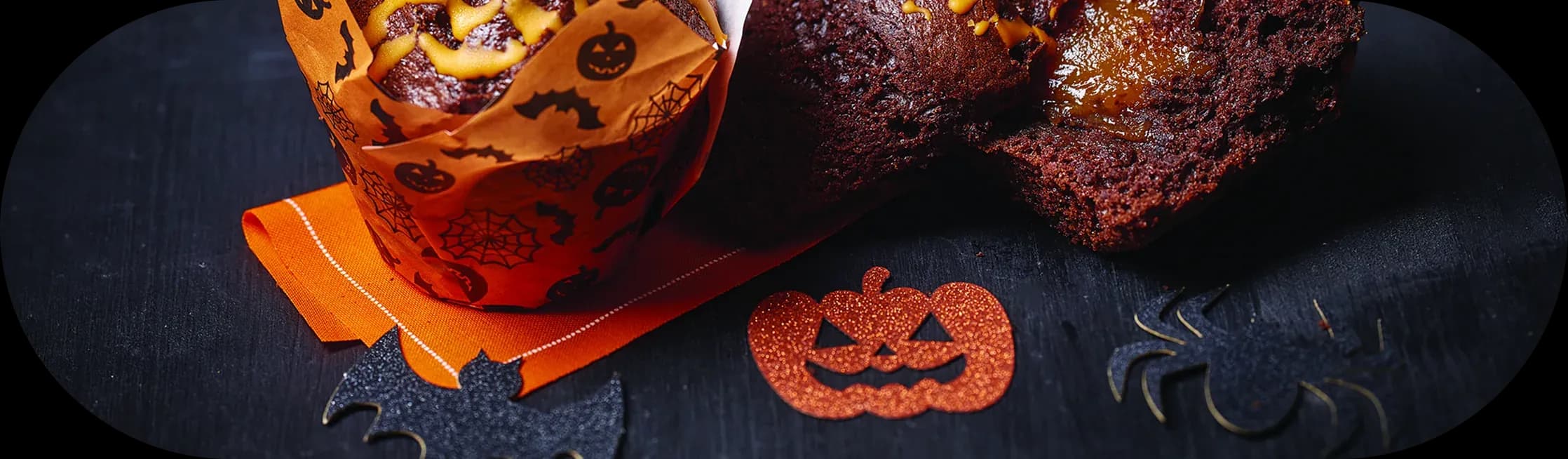 Halloween chocolate muffins with pumpkin decorations