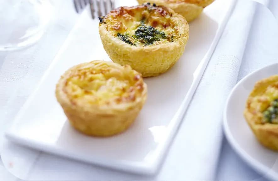 Mini quiches on a white tray