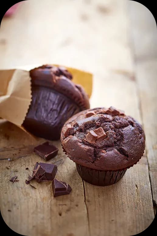 Double chocolate muffin on a wooden table