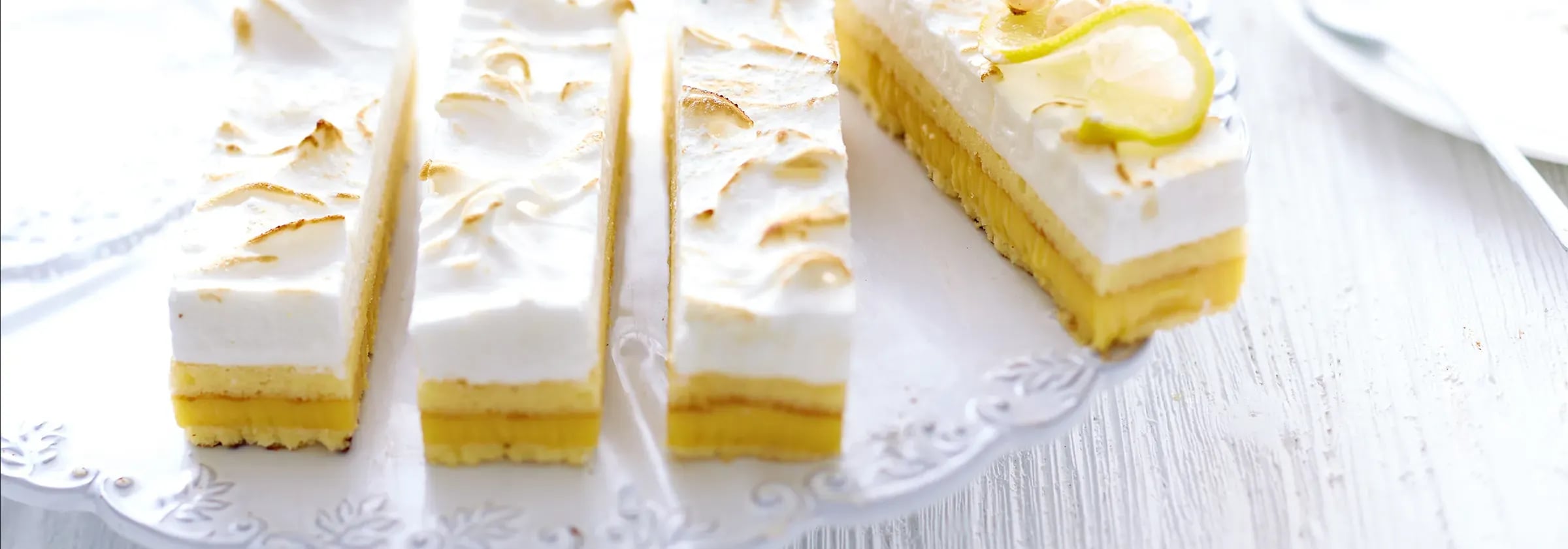 Lemon meringue slices on a lace doily